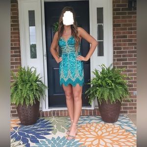 Sherri hill formal dress size 4 with gold beaded detail and a lace up back